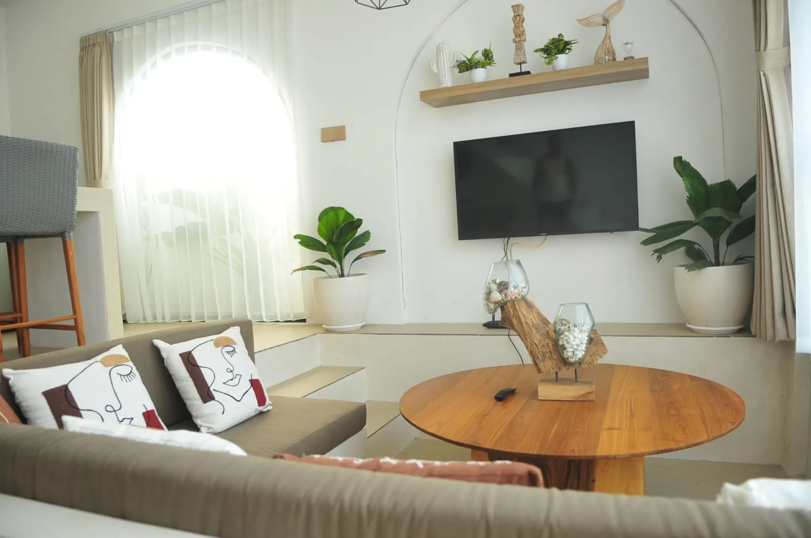Sunken living area with TV in the enclosed living room