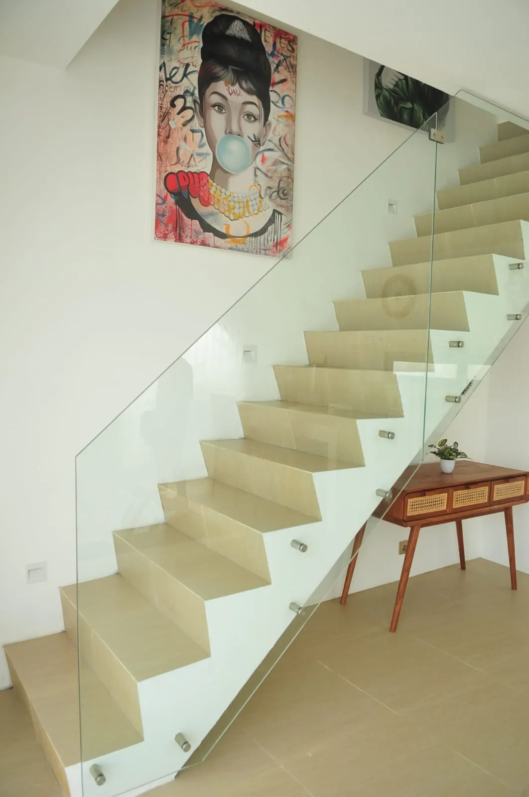 Glass staircase to the upstairs bedroom