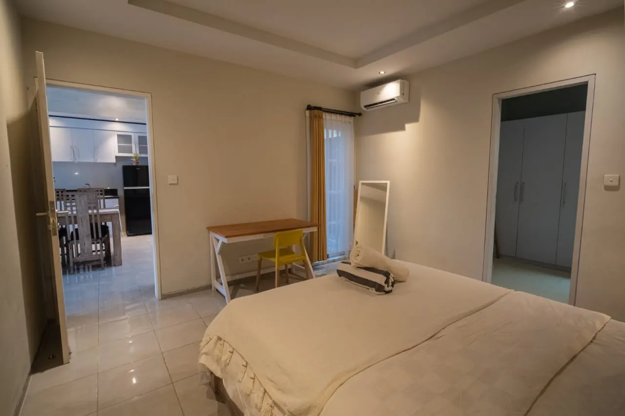 Air-conditioned bedroom with desk